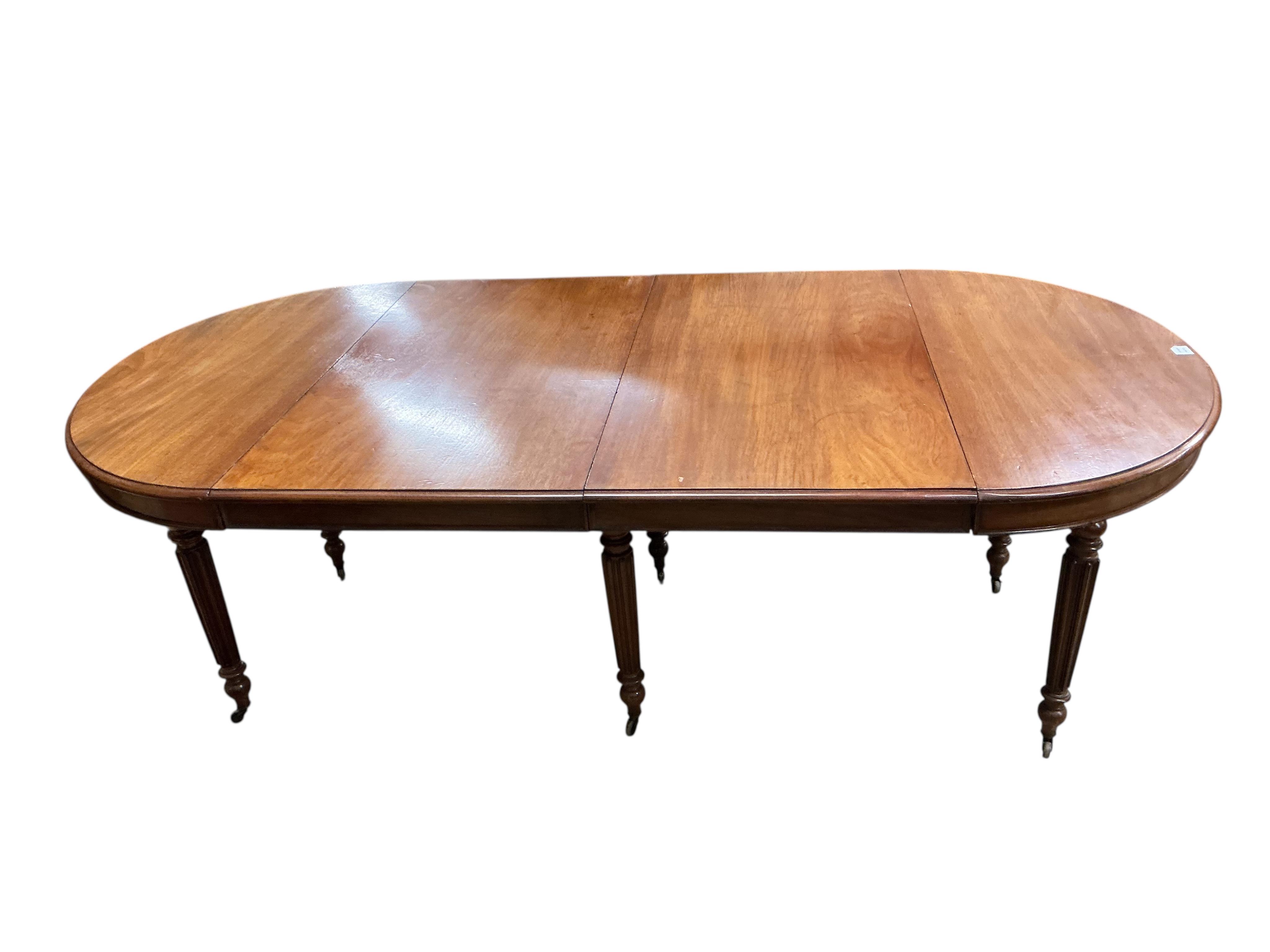 A 19th century French oval mahogany extending dining table, length 214cm extended, two spare leaves, width 102cm, height 70cm